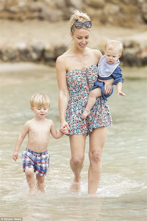 Laura Hamilton shows off her toned figure in a blue bikini